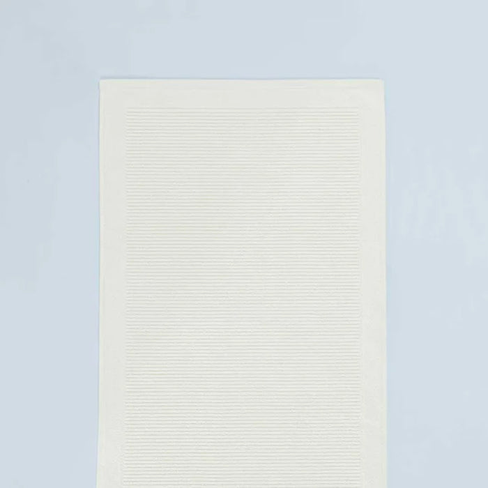 Renew Bath Mat Ivory on a light grey background