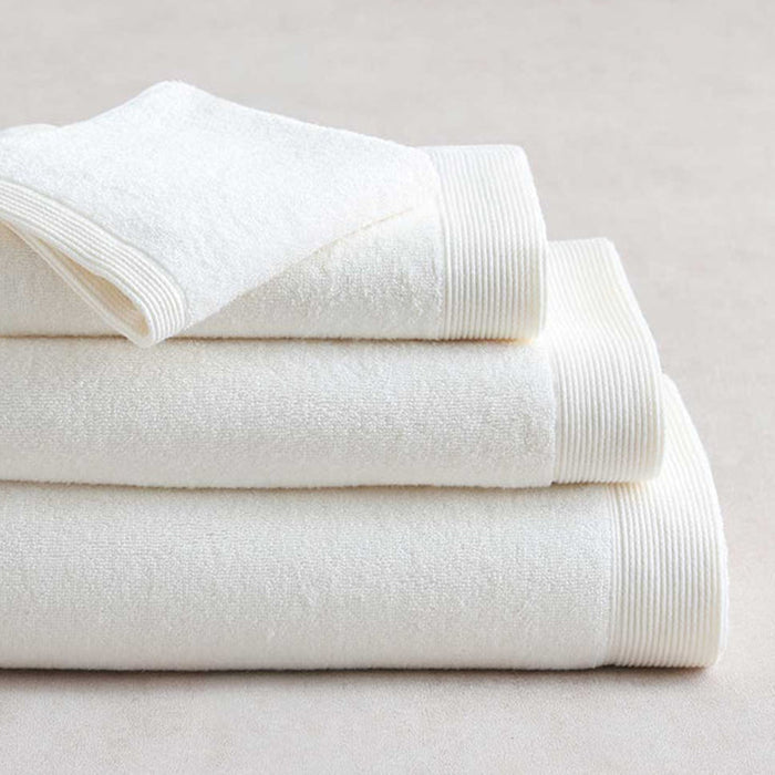 Stack of Renew Towel White on a light gray background