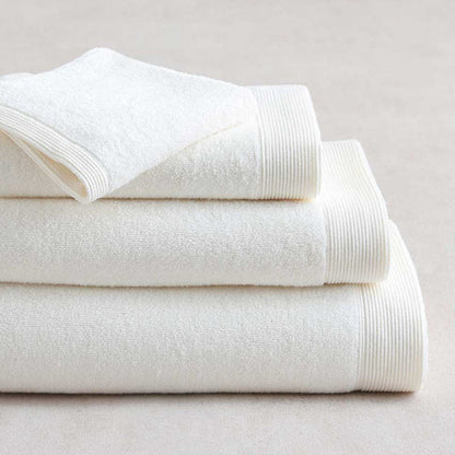 Stack of Renew Towel White on a light gray background