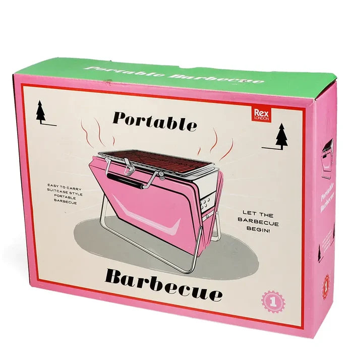 The Rex Portable Suitcase BBQ in pink, featured on its box labeled “Portable Barbecue”—ideal for travel grilling enthusiasts.
