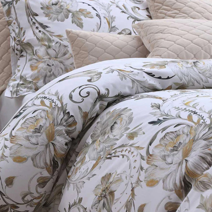 Ruben Duvet Cover Set with beige pillows on a bed