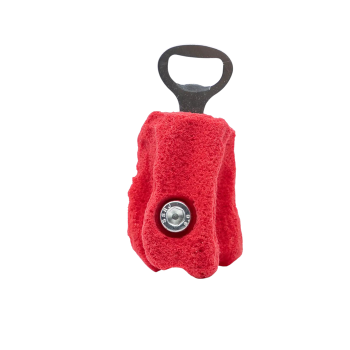 Forager Provisions LTD Seven Peaks red rock climbing hold bottle opener with metal hardware on a white background