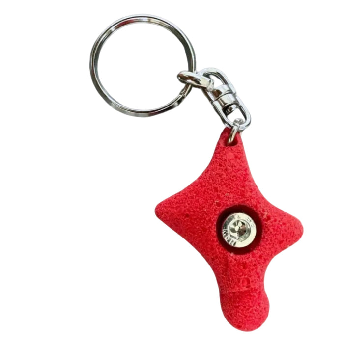 Forager Provisions LTD Seven Peaks red climbing hold keychain with a textured resin finish and metal ring attachment