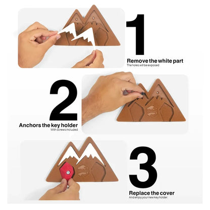 Hands securely mount Seven Peaks Keychain Rock Climber Holder on wall, screwing and replacing cover in clear steps.