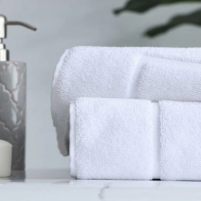 Signature Bath Mat White on a marble surface with a soap dispenser in the background.