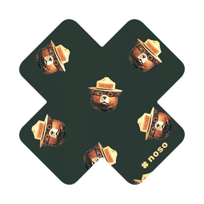 Forager Provisions LTD Smokey Bear Head Toss x NoSo waterproof repair patch with a repeating bear face pattern.