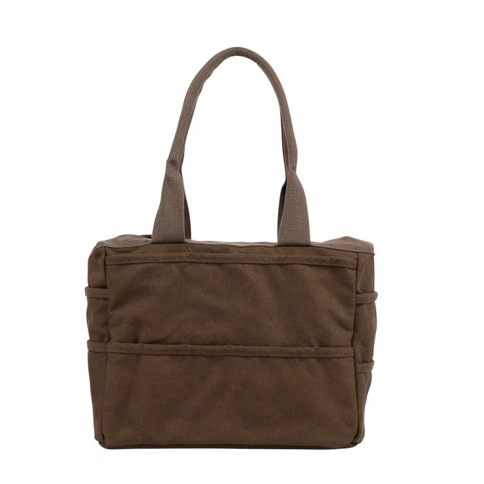 Soolla Studio Pottery Artist Bag in Coffee Bean brown canvas, sturdy handles, spacious pockets, on crisp white background.