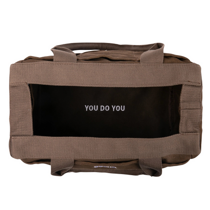 Top view of Soolla Studio Pottery Artist Bag in Coffee Bean, empty, with YOU DO YOU quote at bottom. Soolla branding.