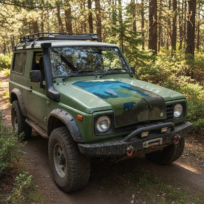 Forager Provisions LTD Sprints Grizzly Guide car seat cover towel featuring a mountain and bear print on a green 4x4