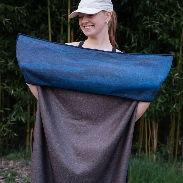 Forager Provisions LTD Sprints Yosemite car seat cover towel held by a smiling woman in a white cap outdoors