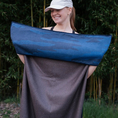 Forager Provisions LTD Sprints Yosemite car seat cover towel held by a smiling woman in a white cap outdoors