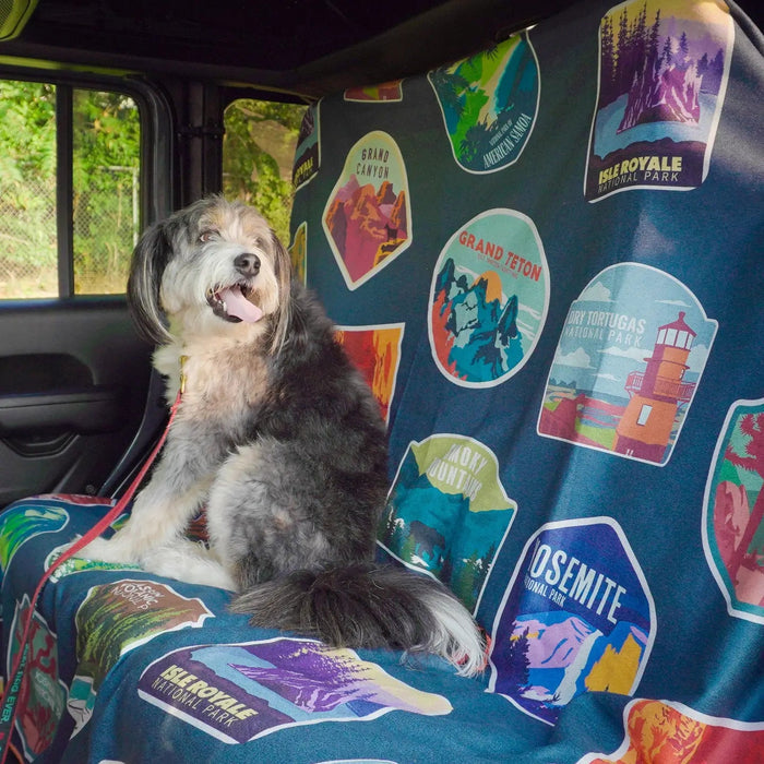 Forager Provisions LTD Sprints car seat towel featuring a National Parks print with a dog sitting on the back seat.