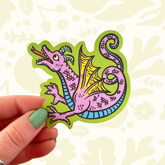 Forager Provisions LTD Stacey McEvoy Caunt vinyl sticker featuring a whimsical purple medieval dragon illustration