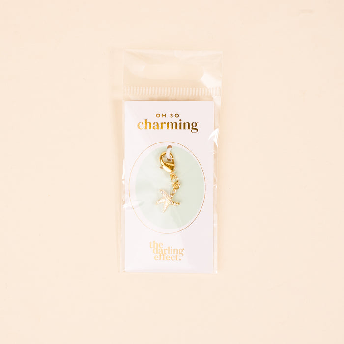 The Darling Effect’s Starfish Jewelry Charm Gold features sparkling rhinestones and a clasp, perfect for adding to your jewelry charm collection or charm bar.
