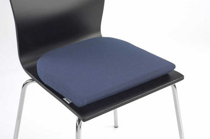 Tempur seat pad on a black chair on a white background