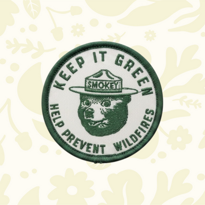 Forager Provisions LTD Smokey Bear Keep It Green embroidered patch on an olive green baseball cap