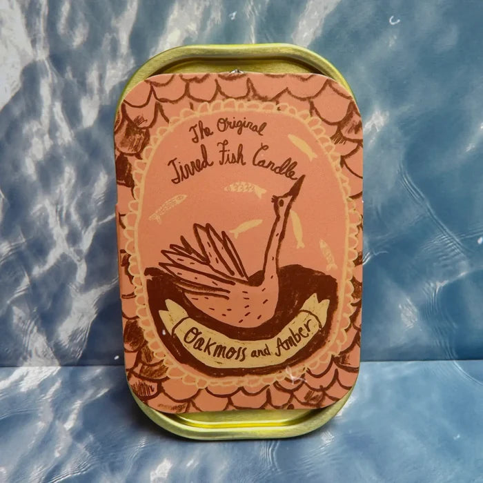 The Original Tinned Fish Candle Oakmoss & Amber by Tinned Candle in blue sardine tin with bird art, luxury scented candle.
