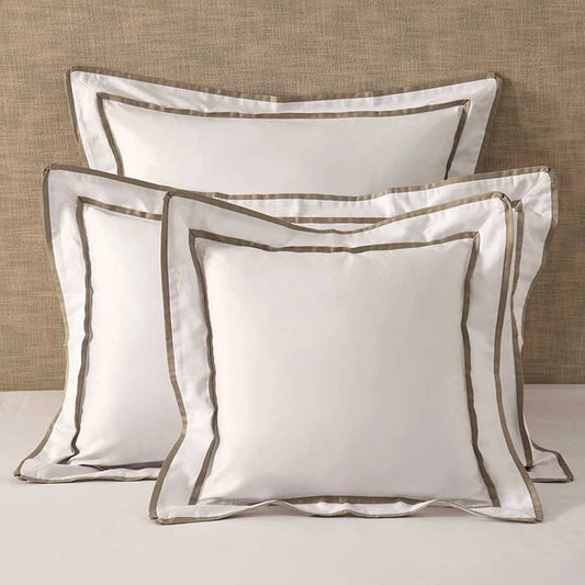 Thenney White Pillowcase and Cushion on a neutral background