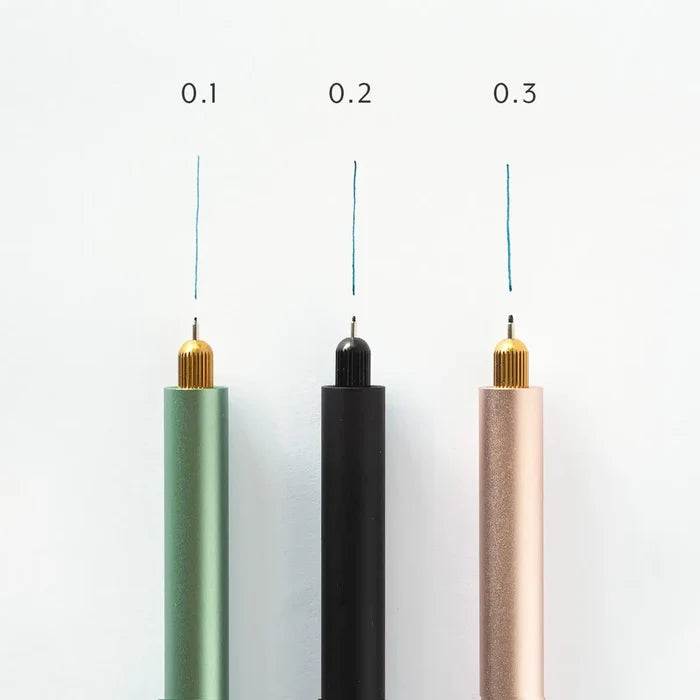 Tom’s Studio Lumos pen set: 0.1, 0.2, 0.3 tips create thin blue lines on white backgrounds. Precision art tools.