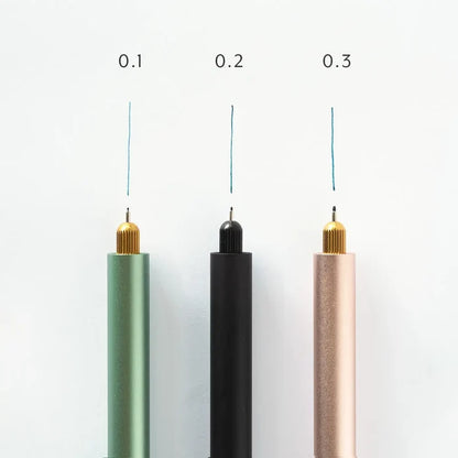Tom’s Studio Lumos pen set: 0.1, 0.2, 0.3 tips create thin blue lines on white backgrounds. Precision art tools.