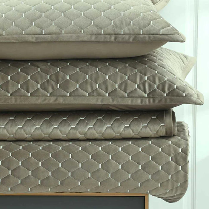 Stack of Turner oak pillows and cushions on Turner Bedrunner Oak
