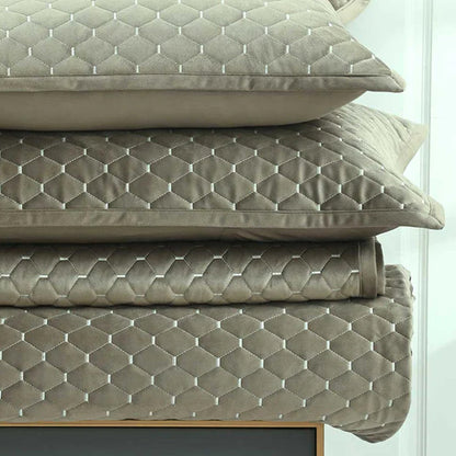 Stack of Turner oak pillows and cushions on Turner Bedrunner Oak