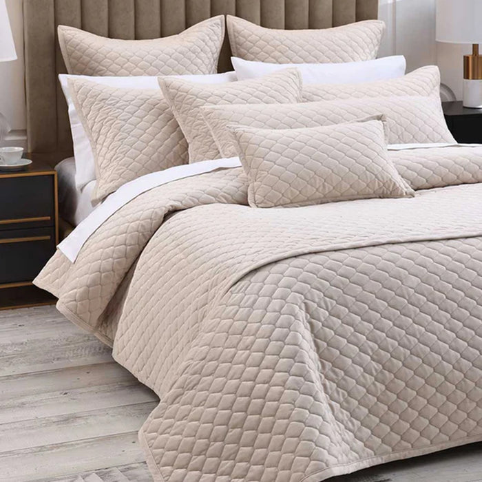 Turner Bedrunner Latte on a bed with pillows and cushions in a bedroom setting.