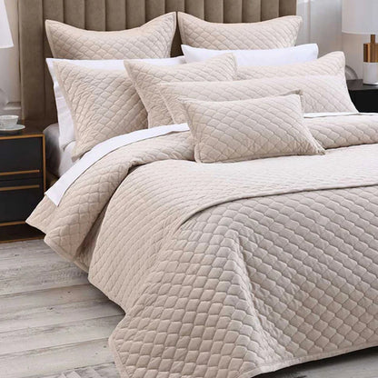 Turner Bedrunner Latte on a bed with pillows and cushions in a bedroom setting.