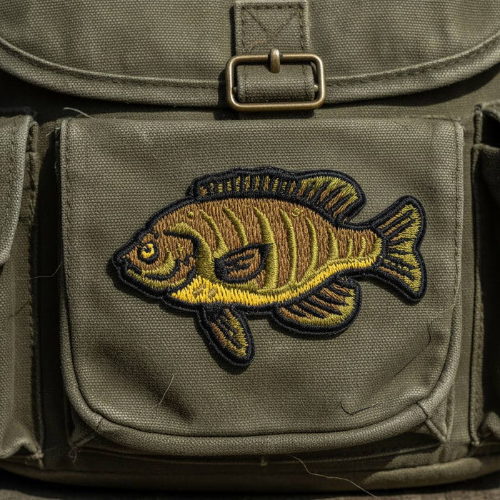 Forager Provisions LTD Union Made bluegill fish embroidered patch on a green canvas backpack pocket