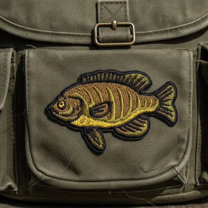 Forager Provisions LTD Union Made bluegill fish embroidered patch on a green canvas backpack pocket