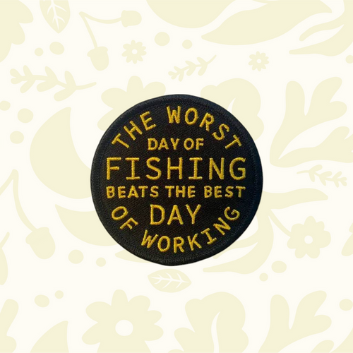 Forager Provisions LTD circular embroidered patch with gold text reading The Worst Day Of Fishing Beats The Best Day Of Working on a black background.