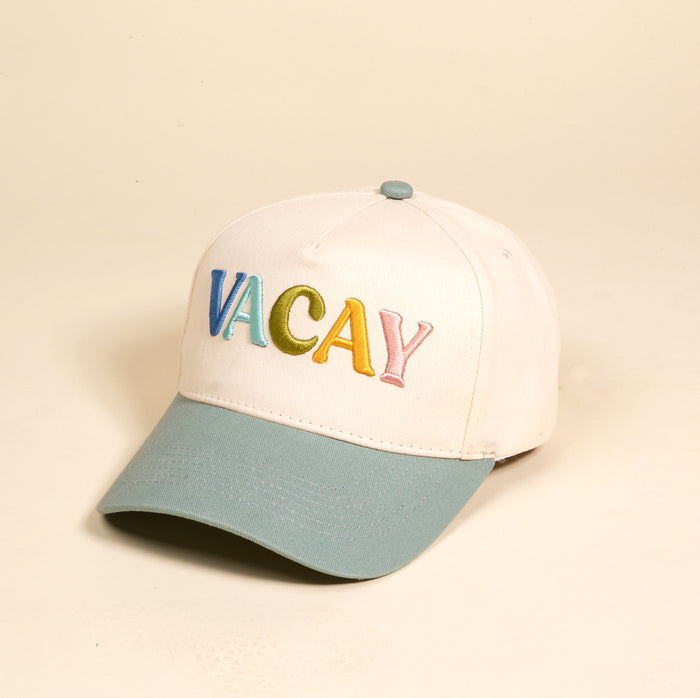 The Darling Effect’s Vacay Classic Canvas Hat features a white canvas base, light blue brim and button, and “VACAY” embroidered in rainbow letters—a fun, casual accessory for everyday wear.