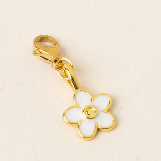 The White Flower Jewelry Charm Gold by the-darling-effect features a five-petal white flower with a gold center and lobster clasp. Perfect for your charm bar, this unique piece is displayed on a plain, light background.