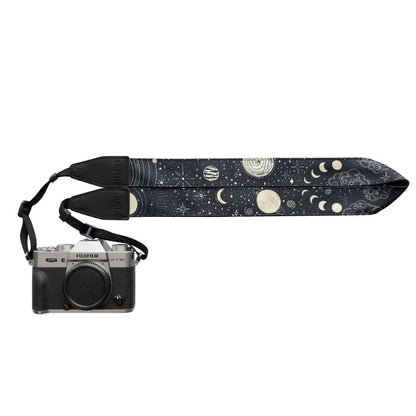 Forager Provisions LTD Wildtree camera strap featuring a celestial sun and moon pattern on a black polyester background.