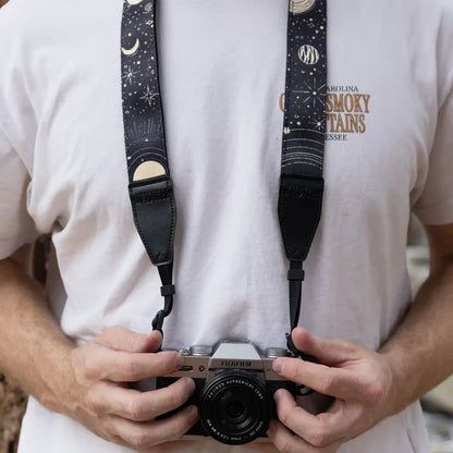 Person with Fujifilm camera, Wildtree Sun & Moon strap, in white T-shirt. Trendy photography gear for stylish photographers.