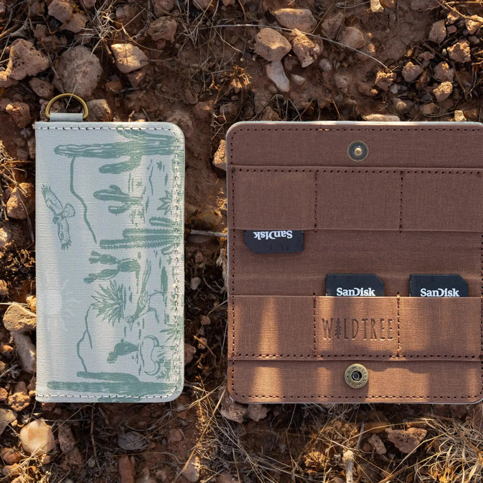Forager Provisions LTD Wildtree card holder with western landscape print, open and closed, holding SD cards on rocks.