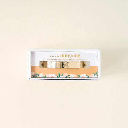The Darling Effect’s You Are Outgoing Cuff Bracelet comes in a small box with a floral design and a card that reads, "You are outgoing. Your outward cheer & charm is contagious." A thoughtful gift for someone special.