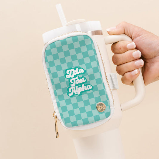 The Darling Effect Zeta Tau Alpha Tumbler Fanny Pack is a teal checkered pouch with white script, attached to a large white tumbler—perfect for fans of stylish sorority accessories.